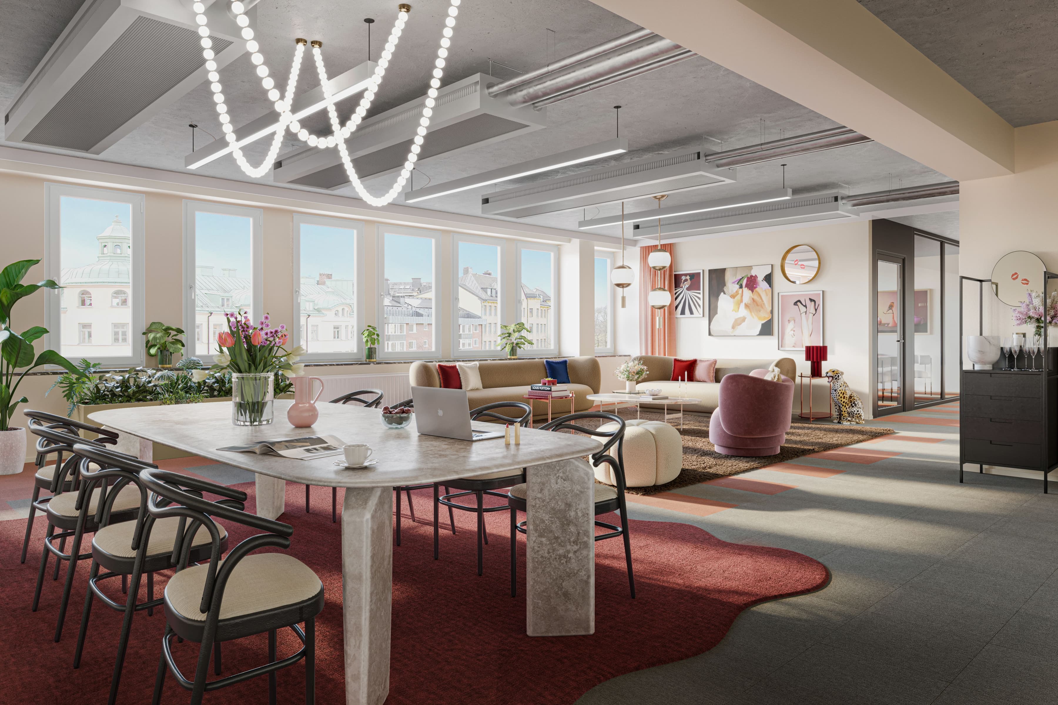 Ett vardagsrum fyllt med möbler och ett stort fönster.