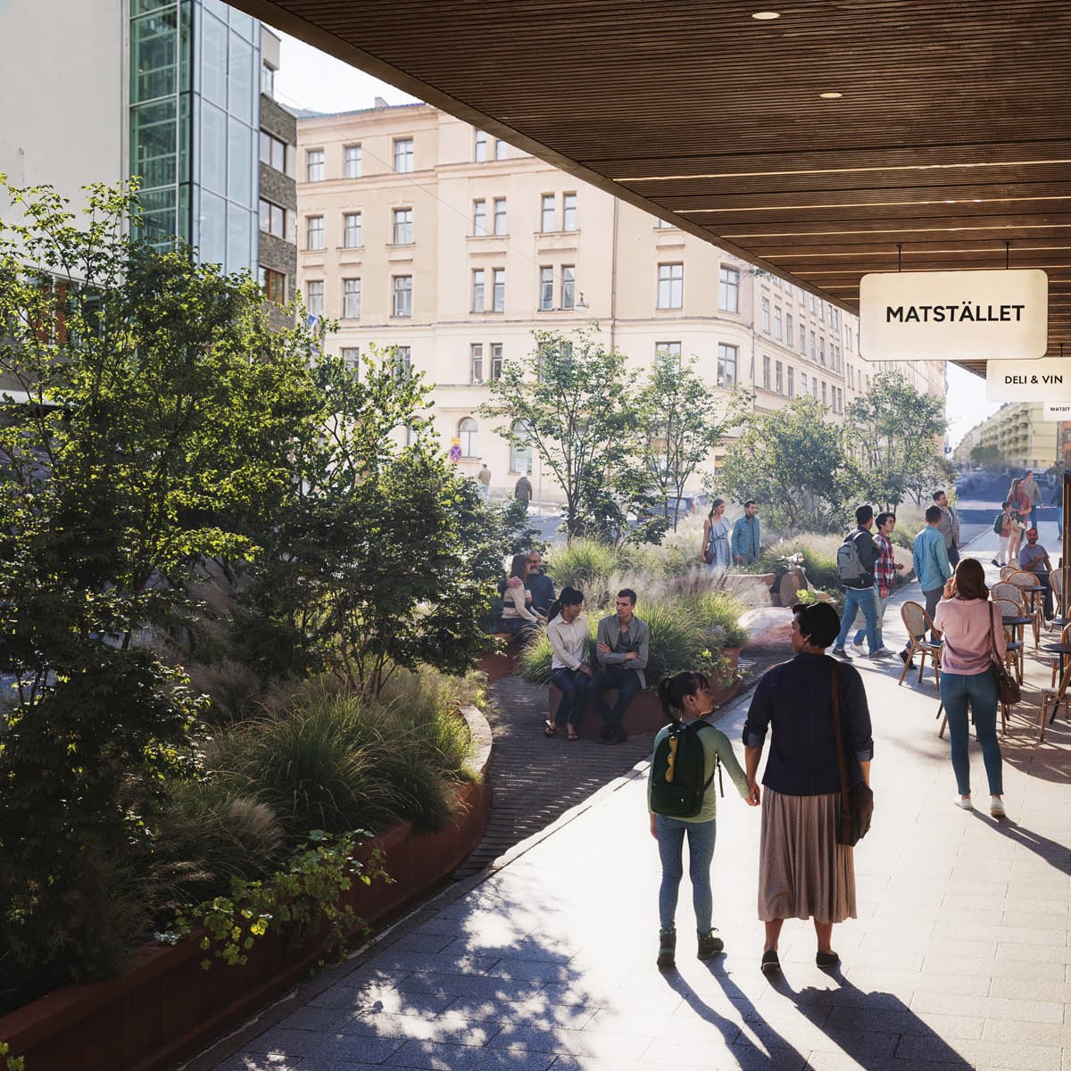 En grupp människor som går längs en trottoar.