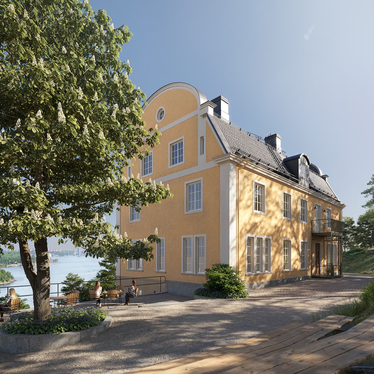 Ett stort gult hus som ligger på toppen av en grönskande sluttning.