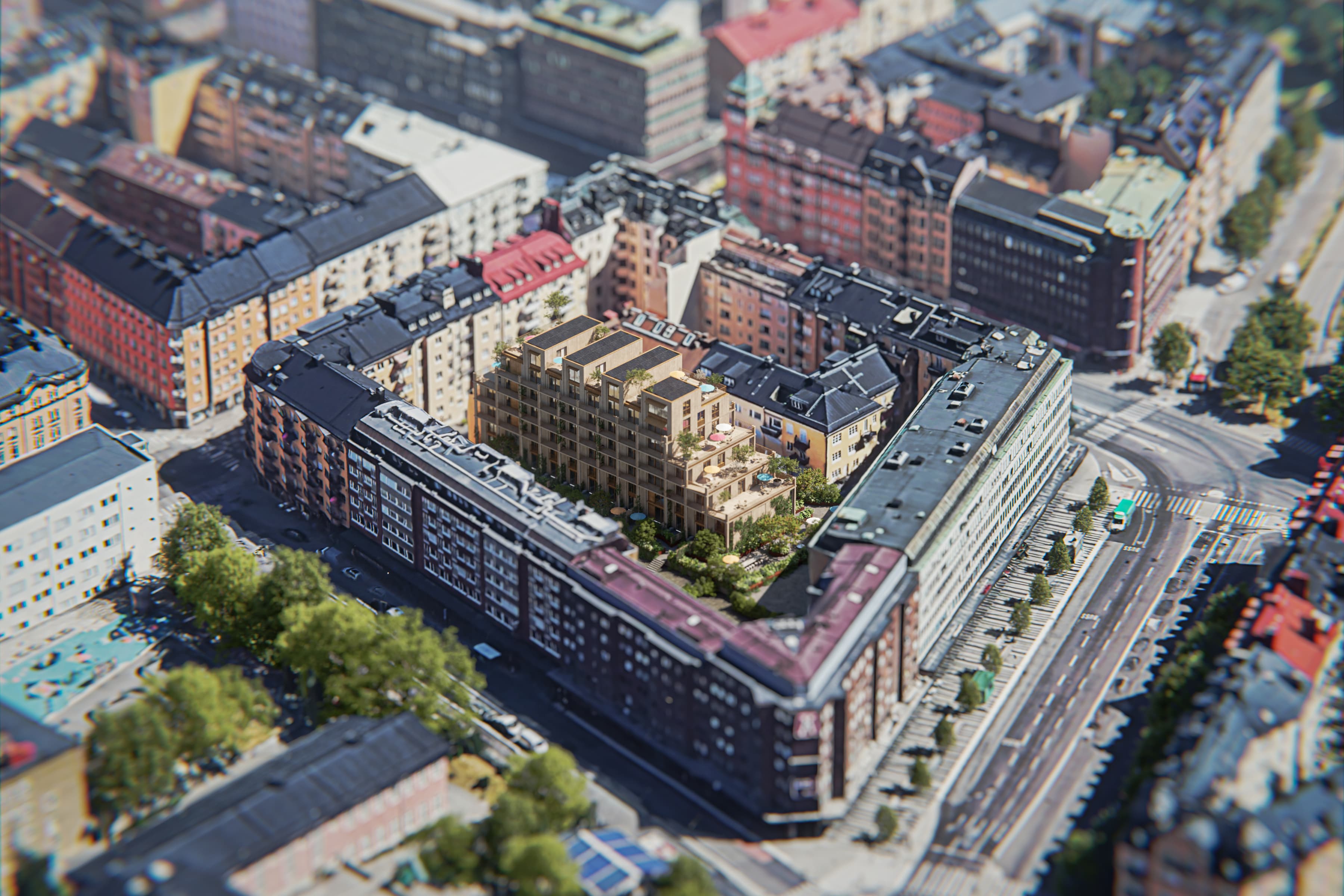 En flygbild av en stad med ett tåg på spåren.