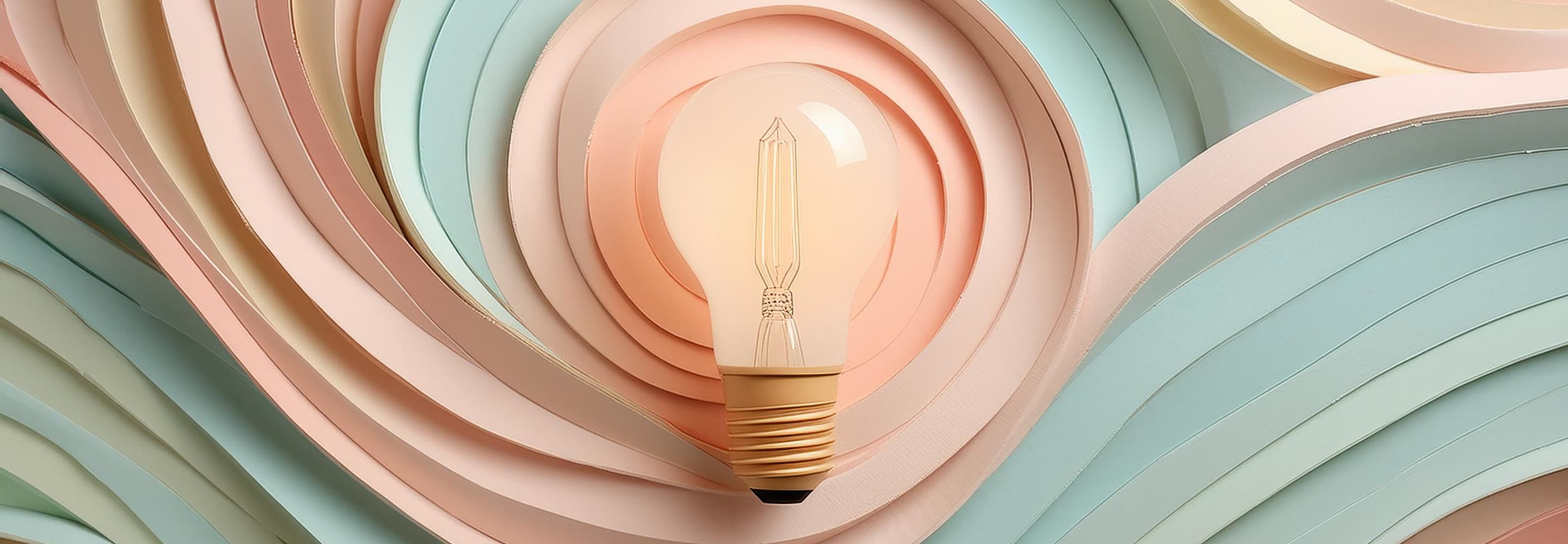 En glödlampa som sitter på en färgstark vägg.