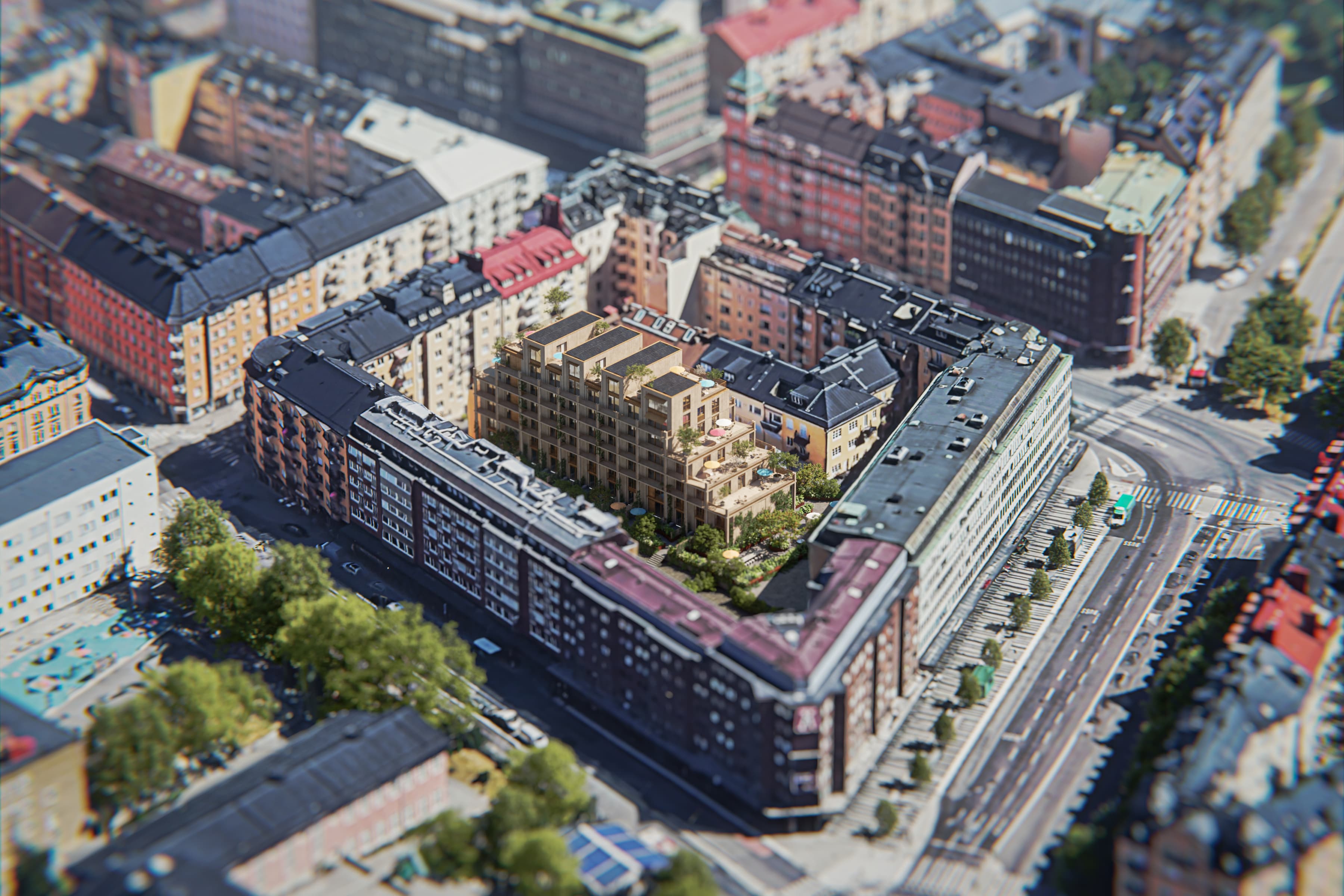 En flygbild av en stad med ett tåg på spåren.