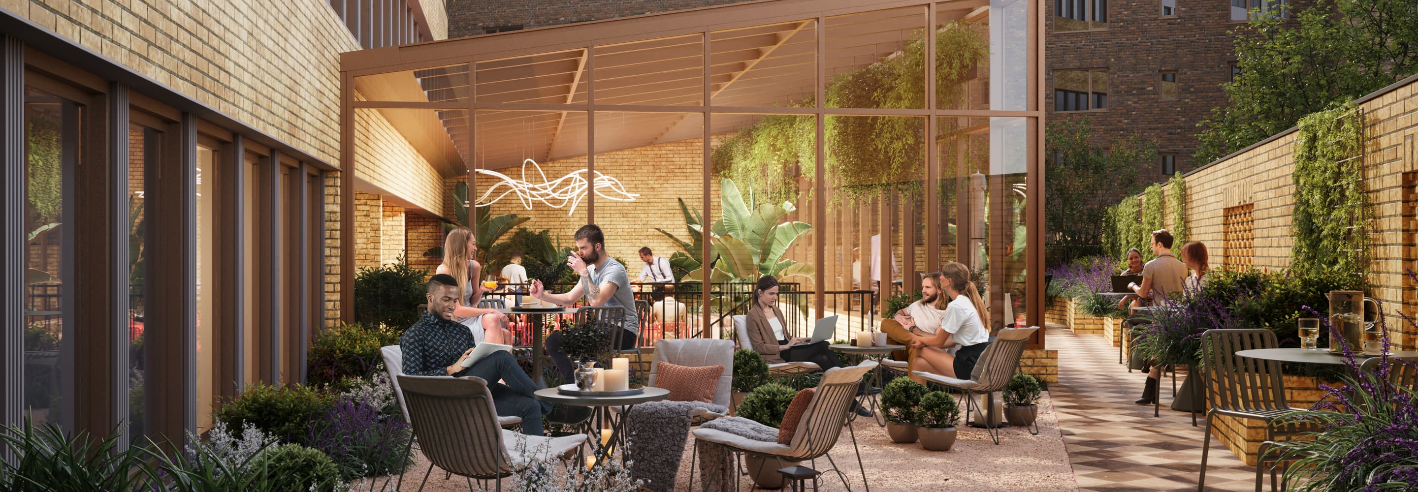 En grupp människor som sitter vid ett bord utanför en byggnad.